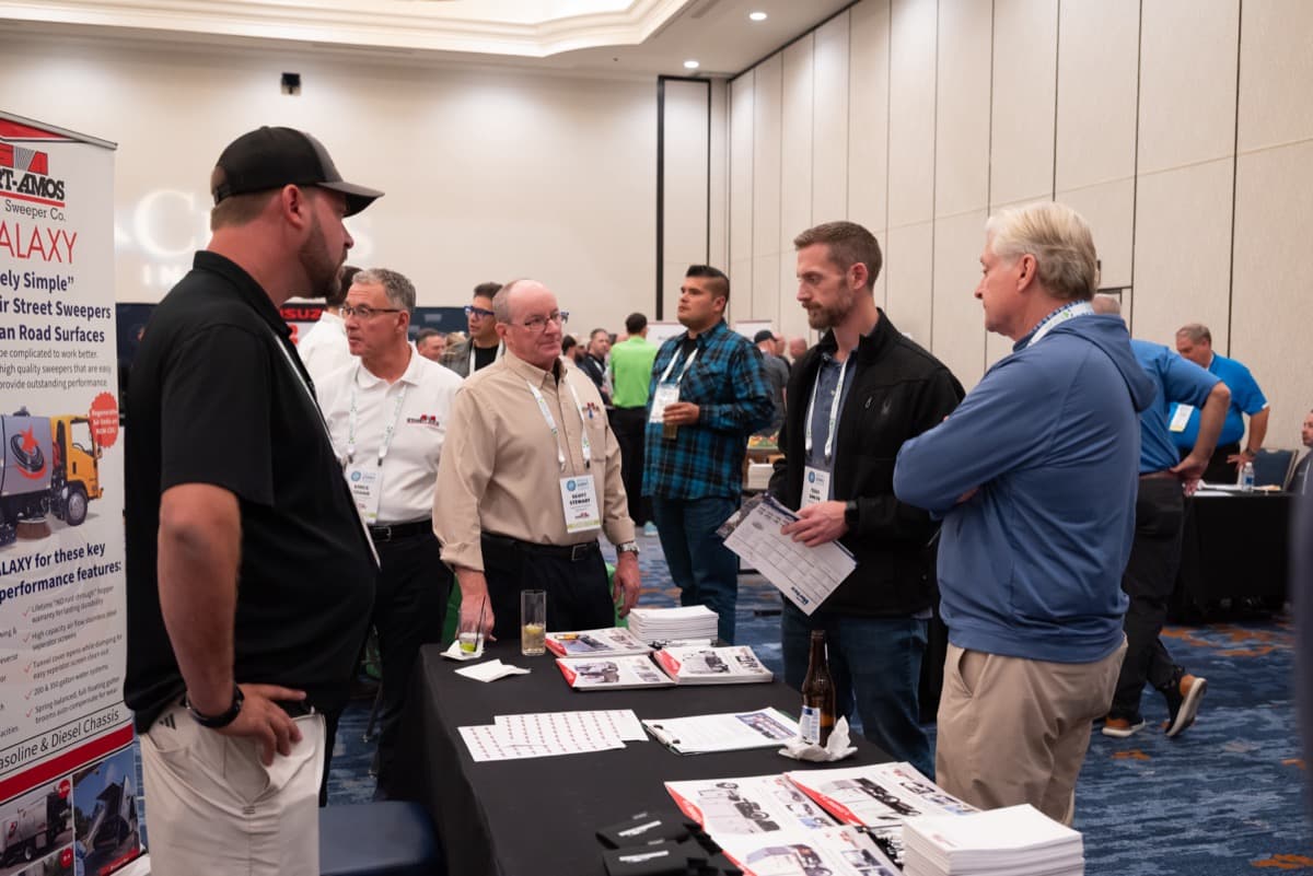 Attendees engaging with exhibitor partners